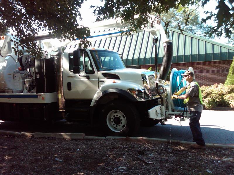 City Employee With Jet Vac Truck